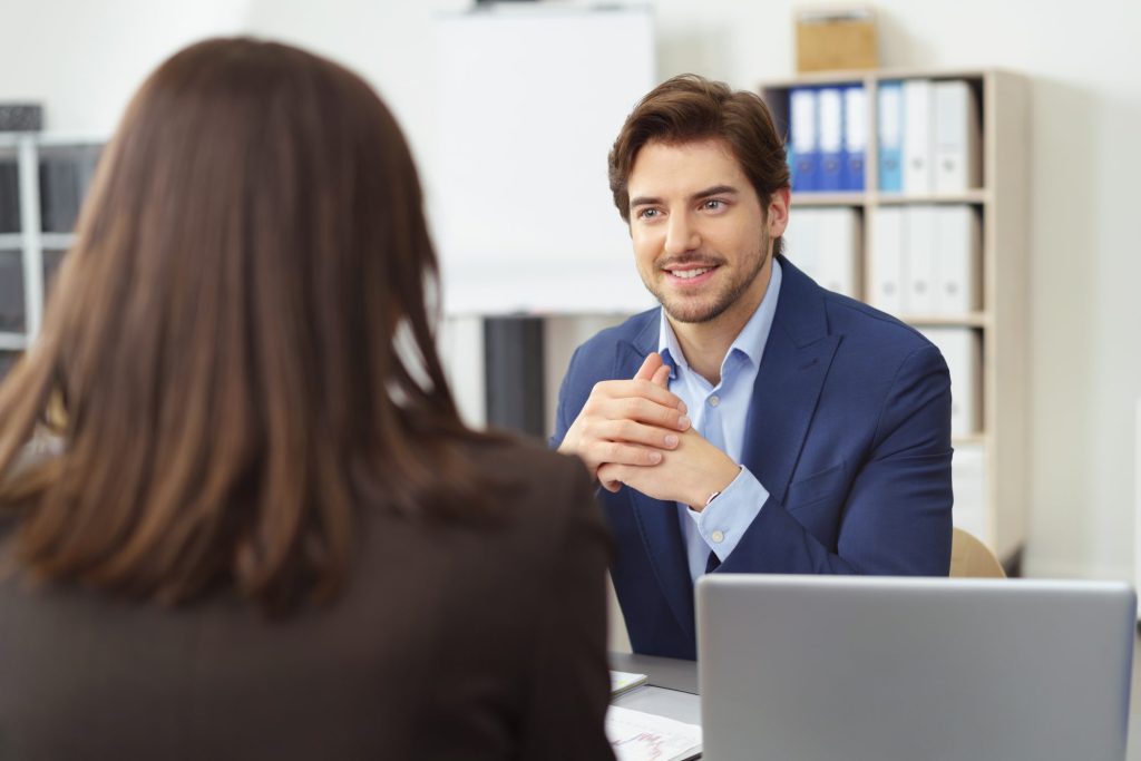 photo of man and woman discussing issues related to long term disability attorneys